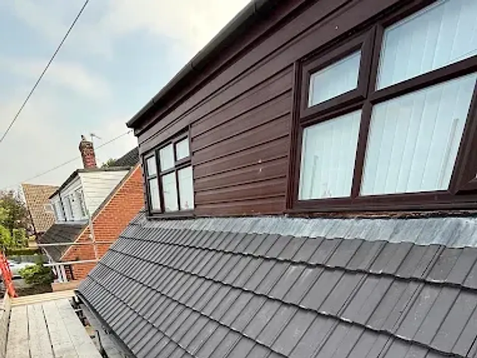 Dormer with a new grey tiled roof