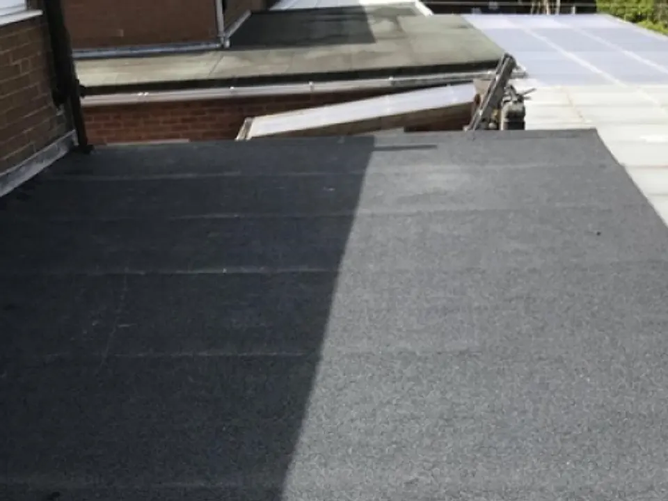 New felt flat roof with parapet edge