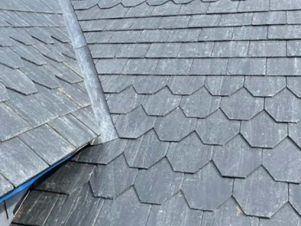 Ornamental fishscale slate detail on a pitched roof