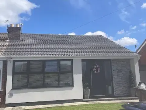 Bungalow with a new grey tiled roof