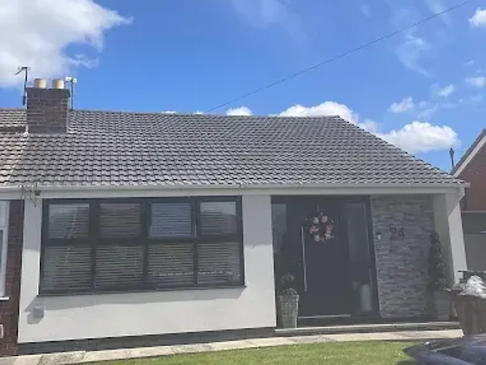 Bungalow with a new grey tiled roof